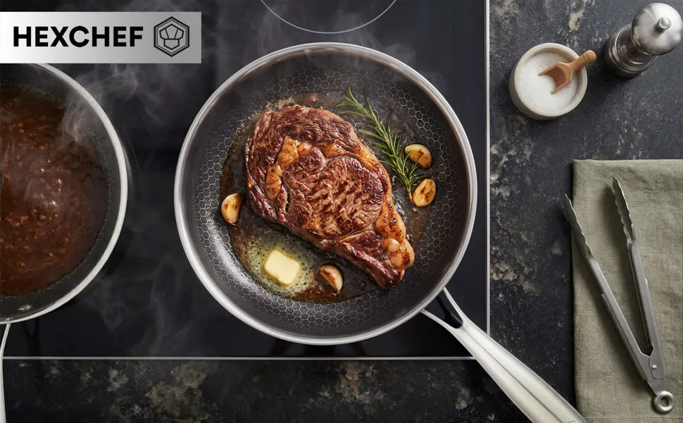 Steak with rosemary and garlic searing in a HexChef frying pan